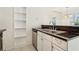 Kitchen featuring stainless steel appliances, dark countertops, and white cabinets at 5638 River Heights Se Xing, Marietta, GA 30067