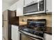Kitchen featuring stainless steel appliances and dark countertops at 5638 River Heights Se Xing, Marietta, GA 30067