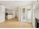 Open-concept living room next to kitchen and access to patio at 5638 River Heights Se Xing, Marietta, GA 30067
