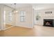 Open living space leading to a fireplace and glass doors to the exterior at 5638 River Heights Se Xing, Marietta, GA 30067