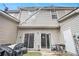 Backyard space with a sliding glass door, white door, and outdoor items at 780 Nehemiah Sw Ln # 37, Atlanta, GA 30331