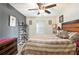 The bedroom offers a ceiling fan, a queen-size bed, and carpeted floors at 780 Nehemiah Sw Ln # 37, Atlanta, GA 30331