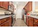 Galley kitchen features stainless steel appliances and ample cabinet space for storage at 780 Nehemiah Sw Ln # 37, Atlanta, GA 30331