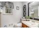 Bright bathroom featuring a large mirror, decorative accents, and a window with natural light at 90 Chimney Rise Ct, Stockbridge, GA 30281