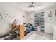 Bedroom features a ceiling fan, natural light and plenty of space for play at 90 Chimney Rise Ct, Stockbridge, GA 30281