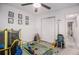 Bright bedroom features a ceiling fan and a play area for  at 90 Chimney Rise Ct, Stockbridge, GA 30281