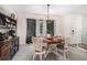 Dining room featuring wood table with seating, window with curtains, and buffet at 90 Chimney Rise Ct, Stockbridge, GA 30281