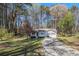 Inviting single-story home with a well-kept lawn, a long driveway, and an attached two-car garage at 90 Chimney Rise Ct, Stockbridge, GA 30281