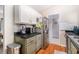 Kitchen featuring stainless steel appliances and a view into the dining room at 90 Chimney Rise Ct, Stockbridge, GA 30281