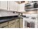 Bright kitchen boasts white cabinets, modern appliances and countertop space at 90 Chimney Rise Ct, Stockbridge, GA 30281