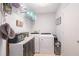 Efficient laundry room with modern appliances, storage solutions, and organized shelving at 90 Chimney Rise Ct, Stockbridge, GA 30281
