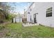 View of the backyard featuring a storage shed, patio with furniture and lush lawn at 350 Marble Springs Rd, Lilburn, GA 30047