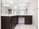 Bathroom with a double sink vanity, tile floors, and a large mirror at 350 Marble Springs Rd, Lilburn, GA 30047