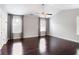 Bright bedroom featuring hardwood floors, two windows with window treatments, and neutral paint at 350 Marble Springs Rd, Lilburn, GA 30047