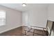 Bedroom featuring hardwood floors, a window with blinds, and a bed frame on wheels at 350 Marble Springs Rd, Lilburn, GA 30047
