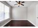 Empty bedroom with ceiling fan, wood floors and white trim at 350 Marble Springs Rd, Lilburn, GA 30047