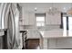 Bright kitchen boasting hardwood floors, stainless appliances, center island, and ample cabinet space at 350 Marble Springs Rd, Lilburn, GA 30047