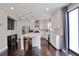 Modern kitchen featuring hardwood floors, center island, stainless appliances, and adjacent dining area at 350 Marble Springs Rd, Lilburn, GA 30047