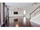 Spacious living room featuring hardwood floors, custom built-ins, fireplace, and adjacent staircase at 350 Marble Springs Rd, Lilburn, GA 30047