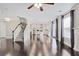 Spacious living room featuring hardwood floors, fireplace, adjacent staircase and stainless appliances at 350 Marble Springs Rd, Lilburn, GA 30047