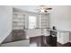 Office with custom built-in shelving and dark wood desk at 350 Marble Springs Rd, Lilburn, GA 30047