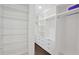 Walk-in closet with multiple shelves, built-in drawers, and space for hanging clothes at 350 Marble Springs Rd, Lilburn, GA 30047