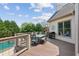Spacious back deck with an outdoor dining area, grill, and view of the pool at 968 Woodtrace Ln, Auburn, GA 30011