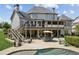 Gorgeous backyard with a pool, patio, and multi-level deck, perfect for outdoor gatherings at 968 Woodtrace Ln, Auburn, GA 30011