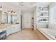 Luxurious bathroom with double vanity, soaking tub, and stylish decor at 968 Woodtrace Ln, Auburn, GA 30011