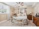 Comfortable bedroom with soft carpet, a metal frame bed, and neutral decor at 968 Woodtrace Ln, Auburn, GA 30011