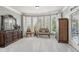 Bright bedroom featuring elegant furnishings and a sitting area with a scenic view at 968 Woodtrace Ln, Auburn, GA 30011