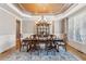 Charming dining room featuring a chandelier, large windows, and traditional decor at 968 Woodtrace Ln, Auburn, GA 30011