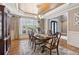 Elegant dining room with a chandelier, tray ceiling, and a formal dining set at 968 Woodtrace Ln, Auburn, GA 30011