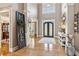 Inviting foyer with high ceilings, hardwood floors, and stylish decor at 968 Woodtrace Ln, Auburn, GA 30011