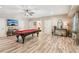 Open game room with a pool table, ceiling fan, recessed lighting, and neutral paint at 968 Woodtrace Ln, Auburn, GA 30011