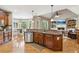 Well-appointed kitchen with stainless steel appliances, a breakfast bar, and an open view into the living area at 968 Woodtrace Ln, Auburn, GA 30011