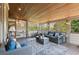 Inviting sunroom with wood ceiling, stylish furniture, and beautiful views of the surrounding landscape at 968 Woodtrace Ln, Auburn, GA 30011