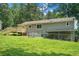 Backyard of home featuring a new deck, patio, and mature trees at 10 Powder Dr, Dallas, GA 30157