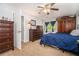 Bedroom with carpet, ceiling fan, and dresser set at 10 Powder Dr, Dallas, GA 30157