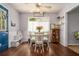 Bright dining area featuring a wood table, stylish chairs, and hardwood floors at 10 Powder Dr, Dallas, GA 30157