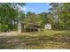 Spacious home with a long driveway, large yard, and separate garage building at 10 Powder Dr, Dallas, GA 30157