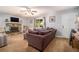 Comfortable living room features a stone fireplace, plush seating, and neutral carpeting at 10 Powder Dr, Dallas, GA 30157