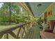 Cozy covered front porch offering a tranquil view of the front yard and lush greenery at 10 Powder Dr, Dallas, GA 30157