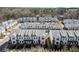 Charming townhome community with well-maintained gray roofs and manicured landscaping at 209 Phillips Ln, Alpharetta, GA 30009