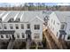 Stylish townhomes with black trim and brick bases, viewed from above at 209 Phillips Ln, Alpharetta, GA 30009