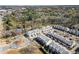 Areal view of stylish, modern townhouses set among trees, landscaping, and walking trails at 209 Phillips Ln, Alpharetta, GA 30009