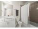 Modern bathroom with large vanity, and bathtub with shower and gray subway tile at 209 Phillips Ln, Alpharetta, GA 30009