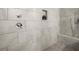 Modern bathroom features a shower with tile surround and built-in shower niche at 209 Phillips Ln, Alpharetta, GA 30009