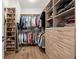 Spacious walk-in closet with custom shelving and ample storage space for clothing and accessories at 209 Phillips Ln, Alpharetta, GA 30009