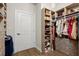 Organized walk-in closet with custom shelving and drawers, maximizing storage options and accessibility at 209 Phillips Ln, Alpharetta, GA 30009